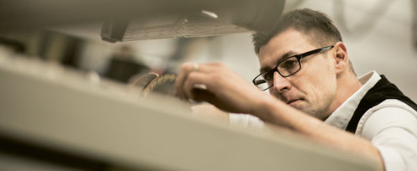 A photo of a woodworker using an Altendorf Hand Guard