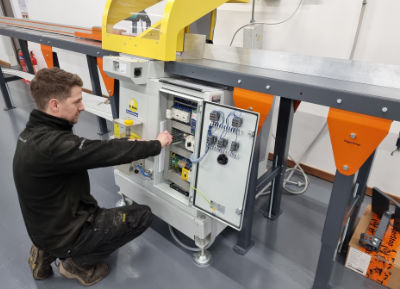 A photo of an R&J Machinery engineer repairing a machine