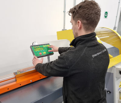 A photo of a man using a panel saw