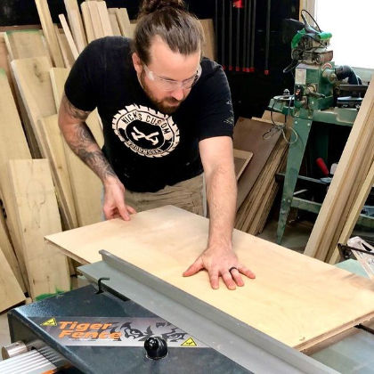 A photo of a man working with his TigerFence